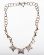 A silver Modernist necklace with shaped spacers, by JRF, London 1995, 64gm.