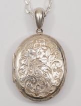 A Victorian silver locket with chased foliate decoration, by J & F.S, Birmingham 1881, on modern