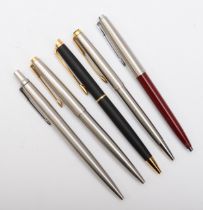 A Cross matt black biro and four Parket biros (5)