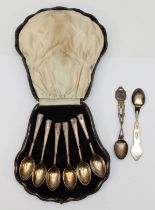 A cased set of George VI silver tea spoons, Sheffield 1943, together with two silver rifle finial