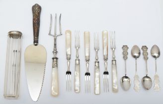 A group of silver items to include four Hong Kong silver tea spoons, silver collared and mother of