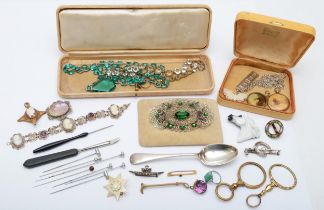 A group of jewellery to include a gold garnet bar brooch, unmarked, 4cm, a silver shell cameo and