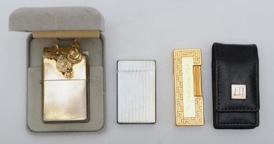 Three lighters to include a Duhill gold plated gas lighter, 57629, inscribed, in a Dunhill leather