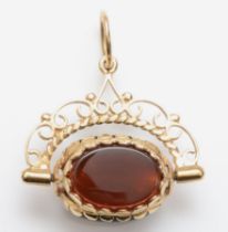 A 9ct gold carnelian, onyx and bloodstone swivel fob pendant, 33 x 27mm, 5.4gm.