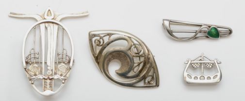 Four silver brooches to include a silver enameled leaf brooch, by Malcolm Gray, 39mm, a silver