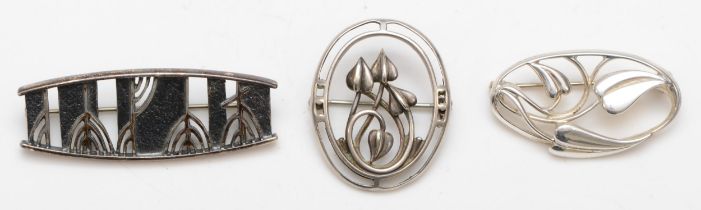 Three Scottish silver brooches to include a abstract trees brooch, 47 x 17mm, all by Ola Gorie, 19.