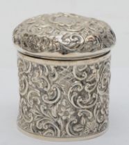 A Victorian silver circular dressing table pot, by Henry Matthews, Chester 1895, with embossed