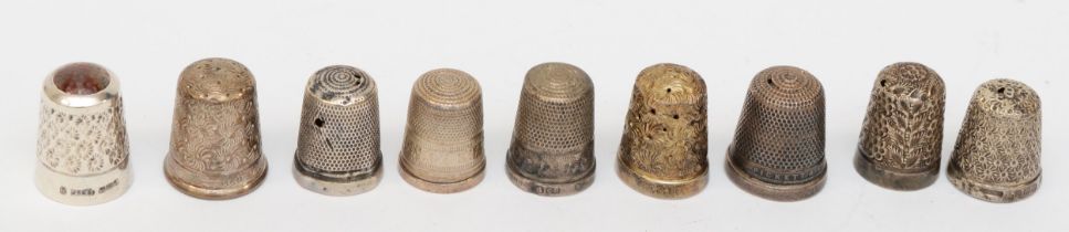 Nine silver thimbles to include a Charles Horner example, 34gm.