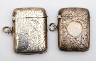 Two Edward VII silver vesta cases, Birmingham 1904, 1905, with chased foliate scroll decoration,