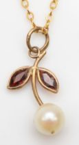 A 9ct gold garnet and cultured pearl floral pendant, on 9ct gold chain, 15mm, 1.3gm.