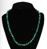 A 9ct gold clasped malachite beaded necklace, 41.5cm.