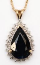 A 9ct gold pear cut sapphire and illusion set diamond pendant, on 375 gold chain, 23mm, 3.6gm.