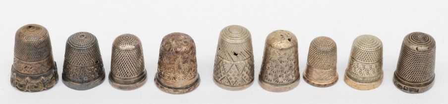 Eight silver thimbles to include a Charles Horner example, 27gm, together with an unmarked thimble.