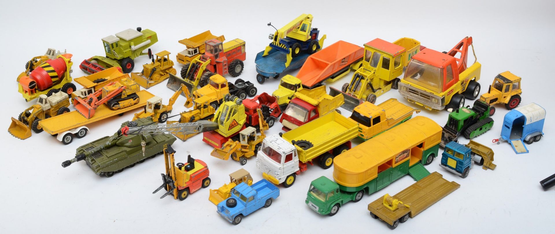 A collection of playworn diecast model vehicles, of farming, commercial and haulage interest,