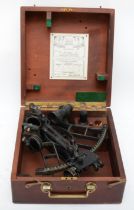 A mahogany cased sextant, stamped with the C and broad arrow of the Royal Canadian Navy used