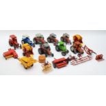 A collection of playworn diecast models by Britains, to include tractors, balers, seed drills,