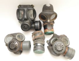A WWII gas mask, a British WD gas mask GD7/68 PR 565 and three other gas masks (5)