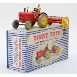 Dinky Toys - A boxed 27AK Farm Tractor & Hay Rake.