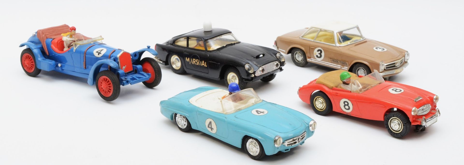 Five 1960s Scalextric racing cars, comprising of a Mercedes 250SL, a Aston Martin D.B.4 and a