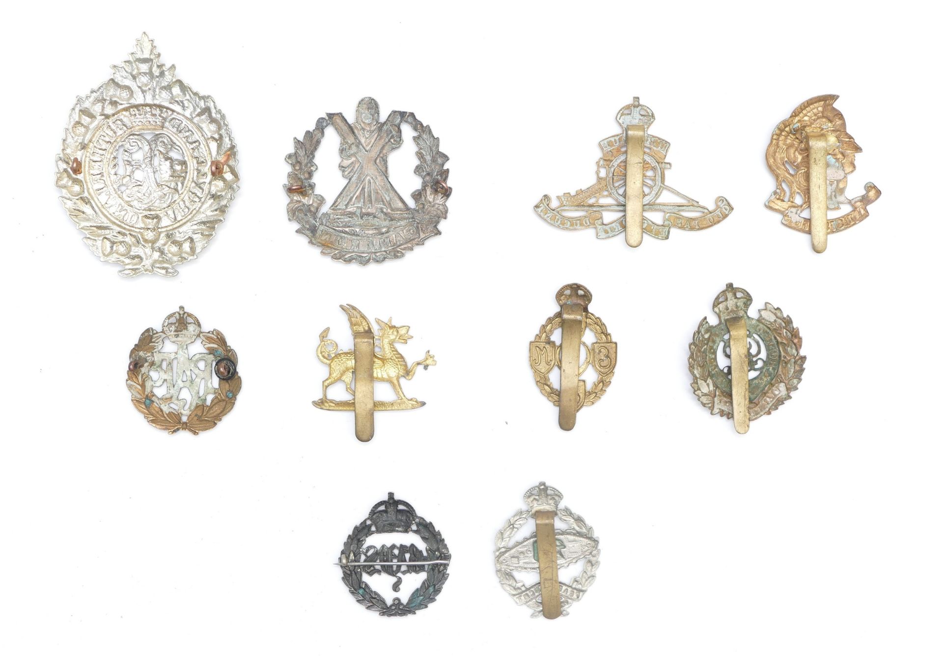 Ten military cap badges to include Artists Rifles and Royal Tank Regiment. - Image 2 of 2