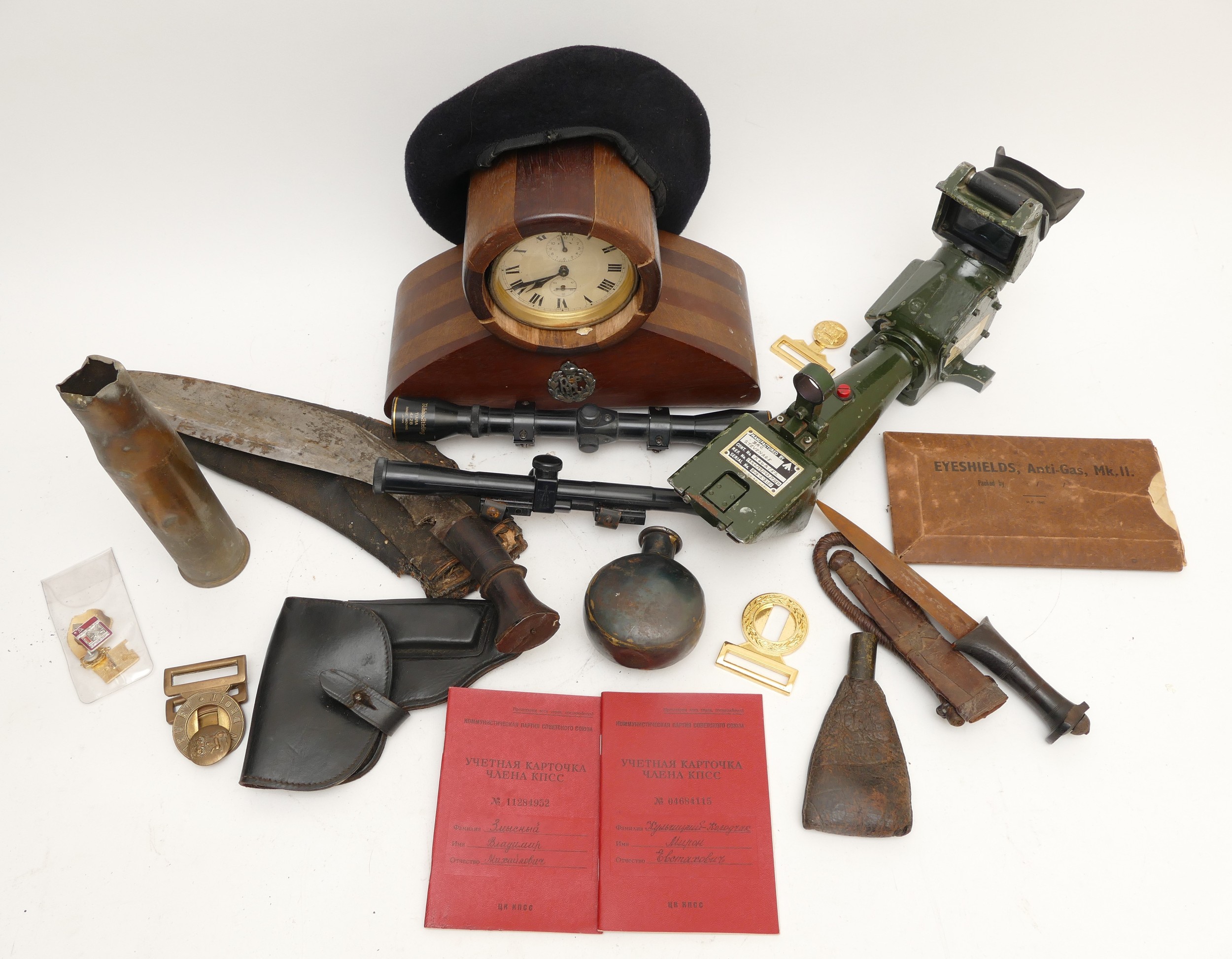 A collection of military items to include a telescope, a Kukri, an Eastern knife, a Nikko Stirling