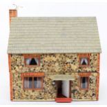 A mid 20th century dolls house 'Seagull Cottage' two story, four rooms with fitted furniture and
