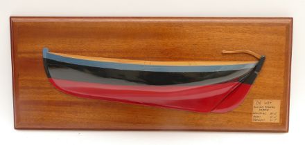 A painted laminated wood half block model of De Wet, mounted on a mahogany frame, signed and dated