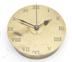 A brass shell case, converted to a quartz clock, diameter 17cm