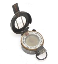 A WWII British military compass, by T.G.Co Ltd, London, numbered 43557, broad arrow, 1940, MkIII,