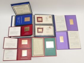 22ct Golden Replicas of British Stamps (13), album, and seven 23ct gold limited edition