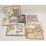 Seven vintage All World stamp albums, including a Victorian cover with one penny and 1/2d stamp,