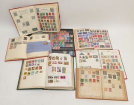 Seven vintage All World stamp albums, including a Victorian cover with one penny and 1/2d stamp,