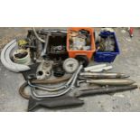 A collection of various motorcycle parts and spares.
