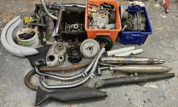 A collection of various motorcycle parts and spares.