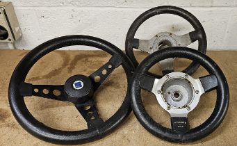 A Mountney leather rim small steering wheel, a BL example and an un-named example (3)