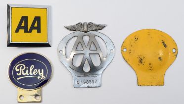 An enamel Riley car bumper badge and two AA badges
