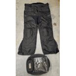 An Oxford Sovereign tank bag and a pair of Crane all weather trousers, unused, size XL