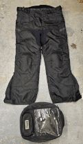 An Oxford Sovereign tank bag and a pair of Crane all weather trousers, unused, size XL