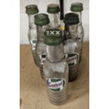 A set of six Castrol glass one pint bottles, all with caps