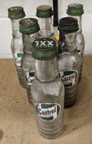 A set of six Castrol glass one pint bottles, all with caps