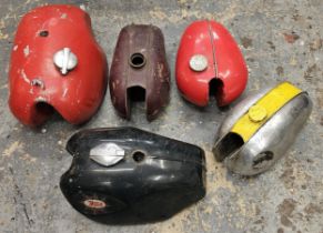 A BSA Gold Star petrol tank and four other tanks