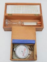 A Shell Slurrimeter glass testing tube, cased and a Wayne Myers engine tester, cased (2)