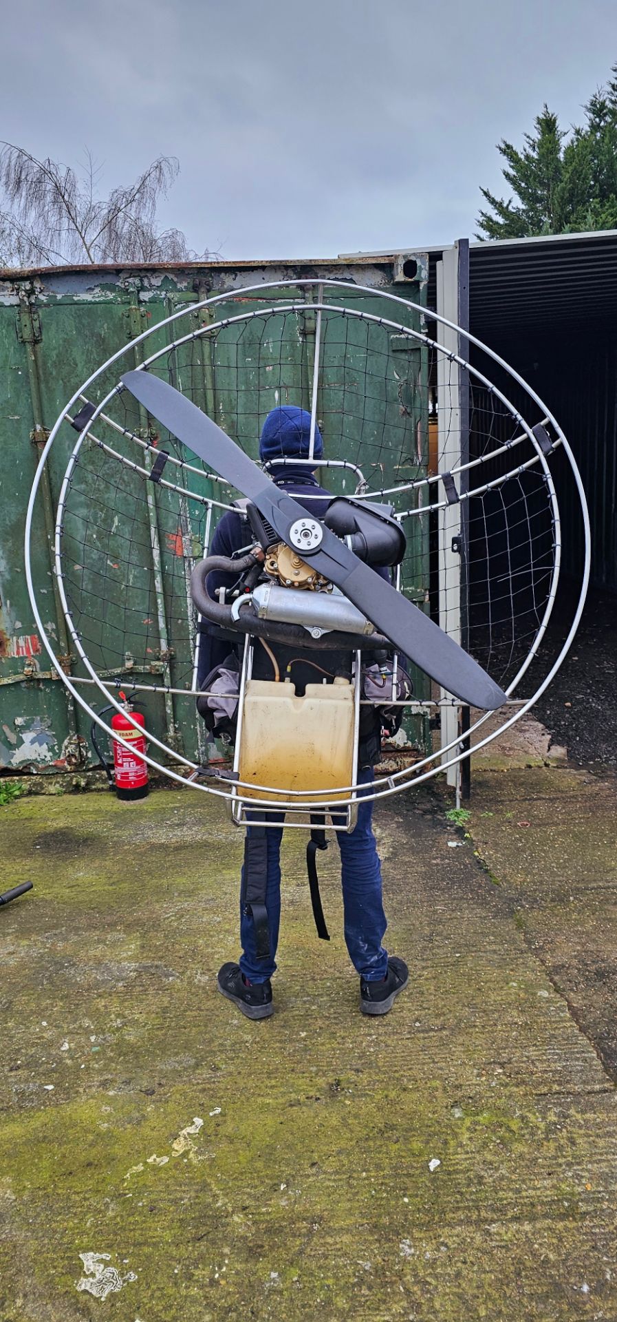 A paramotor with seat, for attachment to a hang glider or similar. Please note, we have not tested