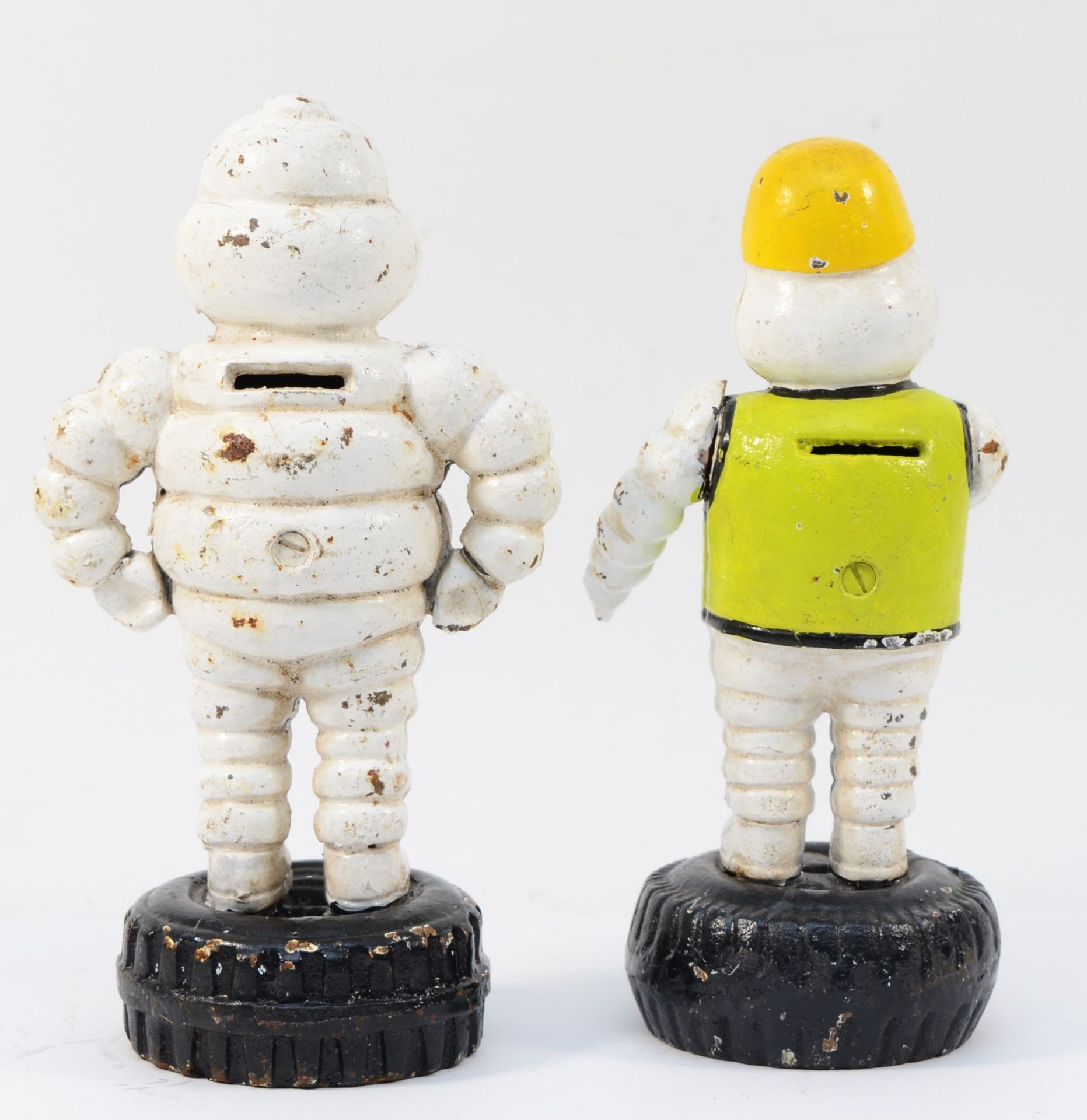A cast iron and painted Bibendum/Michelin Man money box, 22cm and another with moving arms, 21. - Image 2 of 2