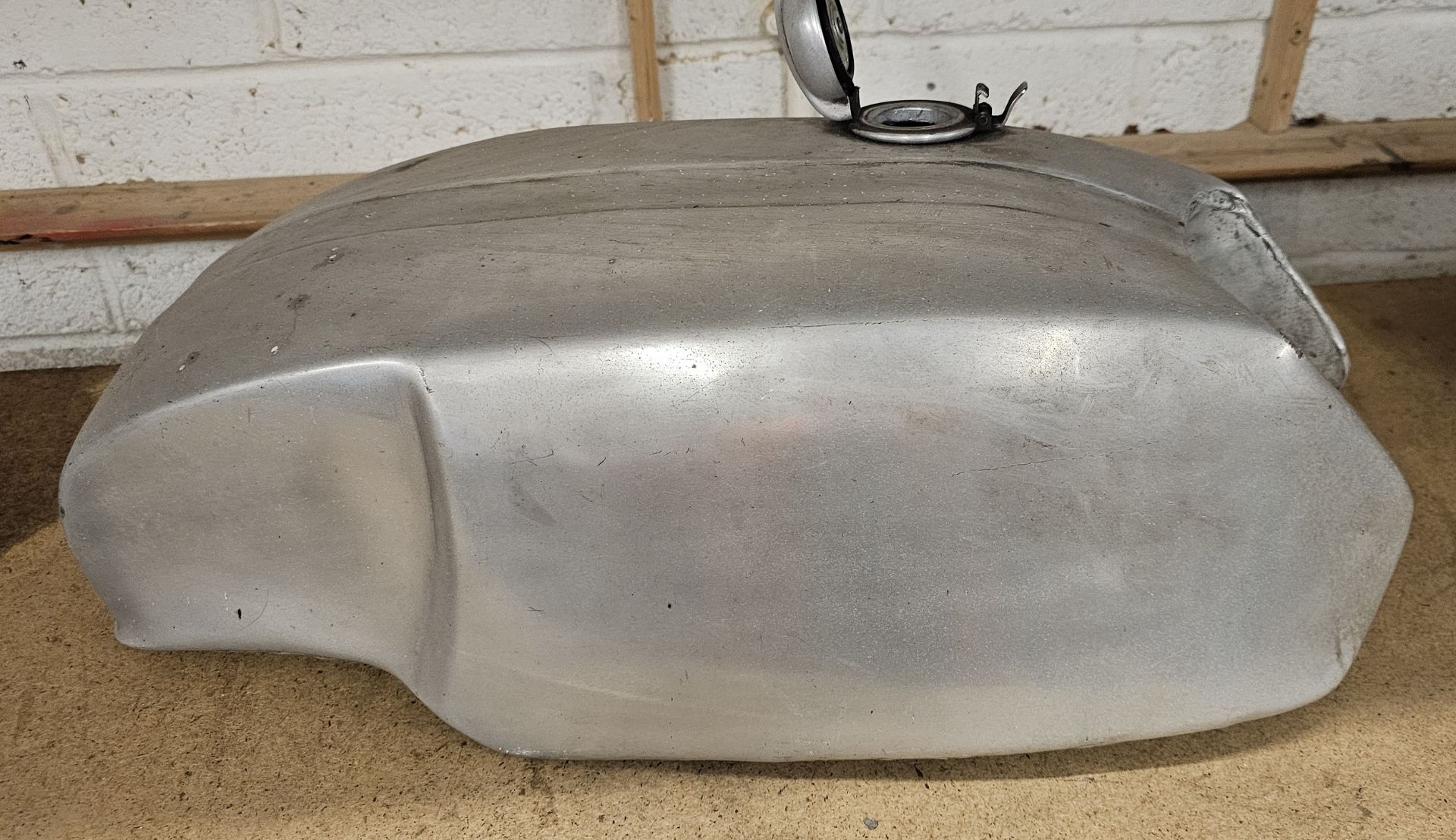 Alloy petrol tank with cap