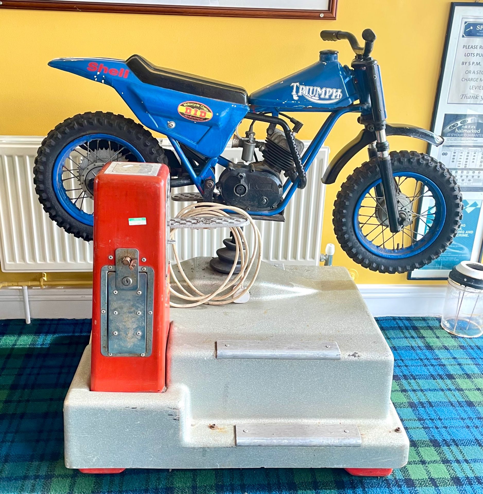 An arcade child's electro-mechanical motorcycle coin operated ride, 120 x 70 x 110cm