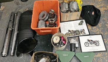 A collection of Moto Guzzi 750 spares, including a NOS starter motor, cylinder heads, cam covers and