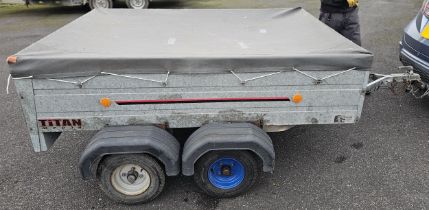 A Titan M7034 twin axle box trailer with cover, approximately 200 x 150cm bed.