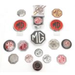 An MG Bakelite ashtray and thirteen various MG badges