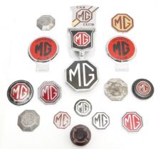 An MG Bakelite ashtray and thirteen various MG badges